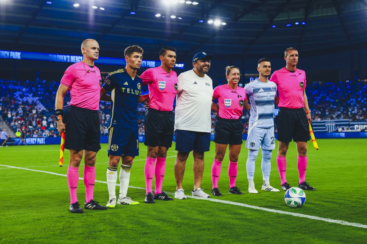 A Propio representative assists with the coin toss before the game vs VAN.