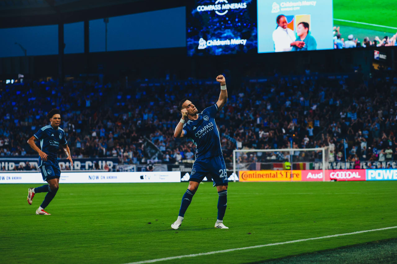 Sporting KC forward Erik Thommy celebrates with his signature "bow and arrow" celebration after his goal vs Real Salt Lake