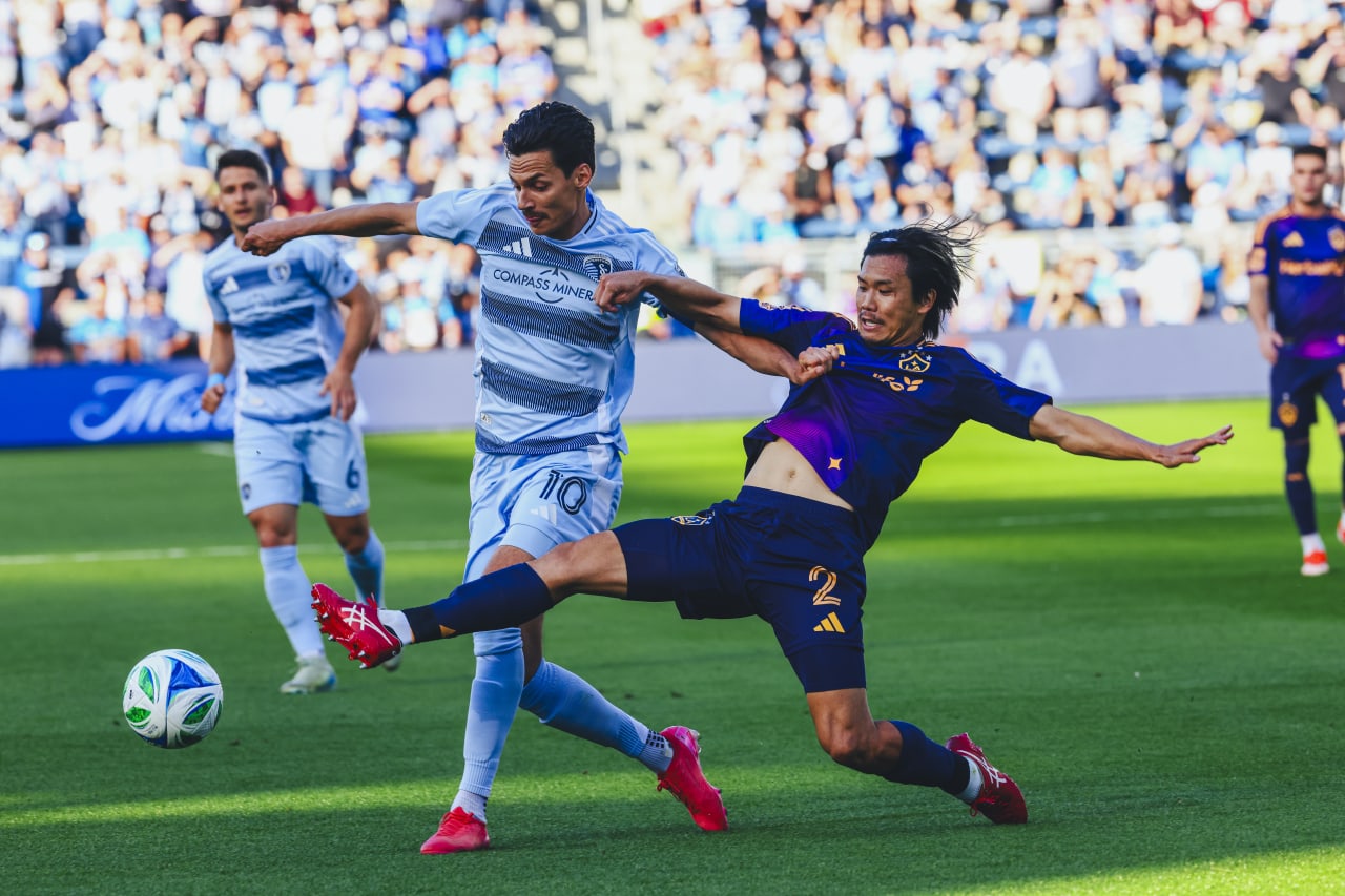 Sporting KC forward Daniel Salloi fights for the ball during the game vs LA