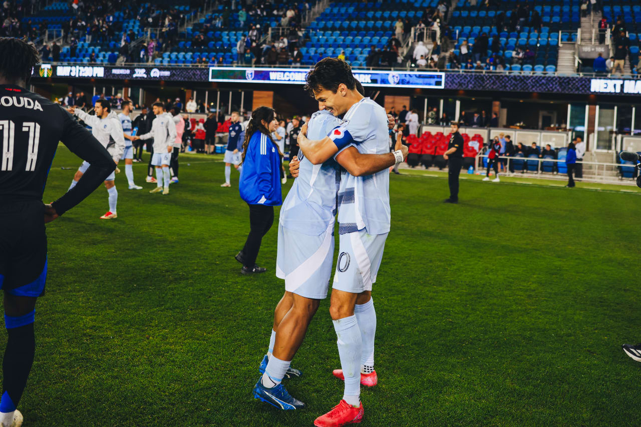 Sporting KC forward Daniel Salloi hugs Sporting KC defender Logan Ndenbe after defeating San Jose