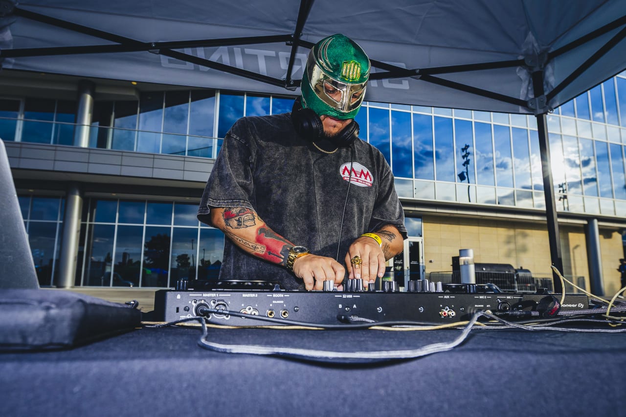 DJ FK Menace mixes before the game vs Vancouver.