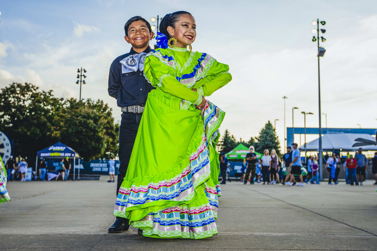 The Guadalupe Center's Aztec Folklórico Dance Team performs on the Mazuma Plaza before the game vs VAN.