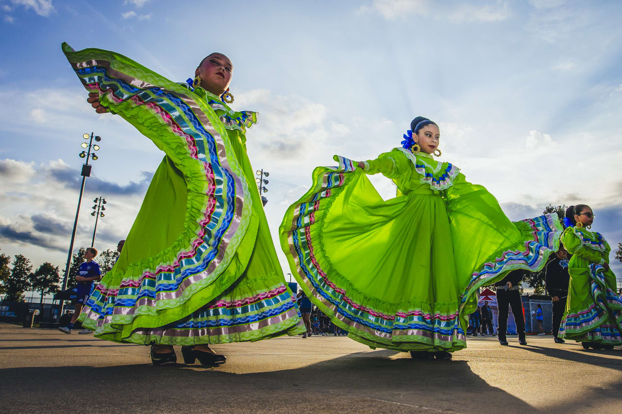 The Guadalupe Center's Aztec Folklórico Dance Team performs on the Mazuma Plaza before the game vs VAN.