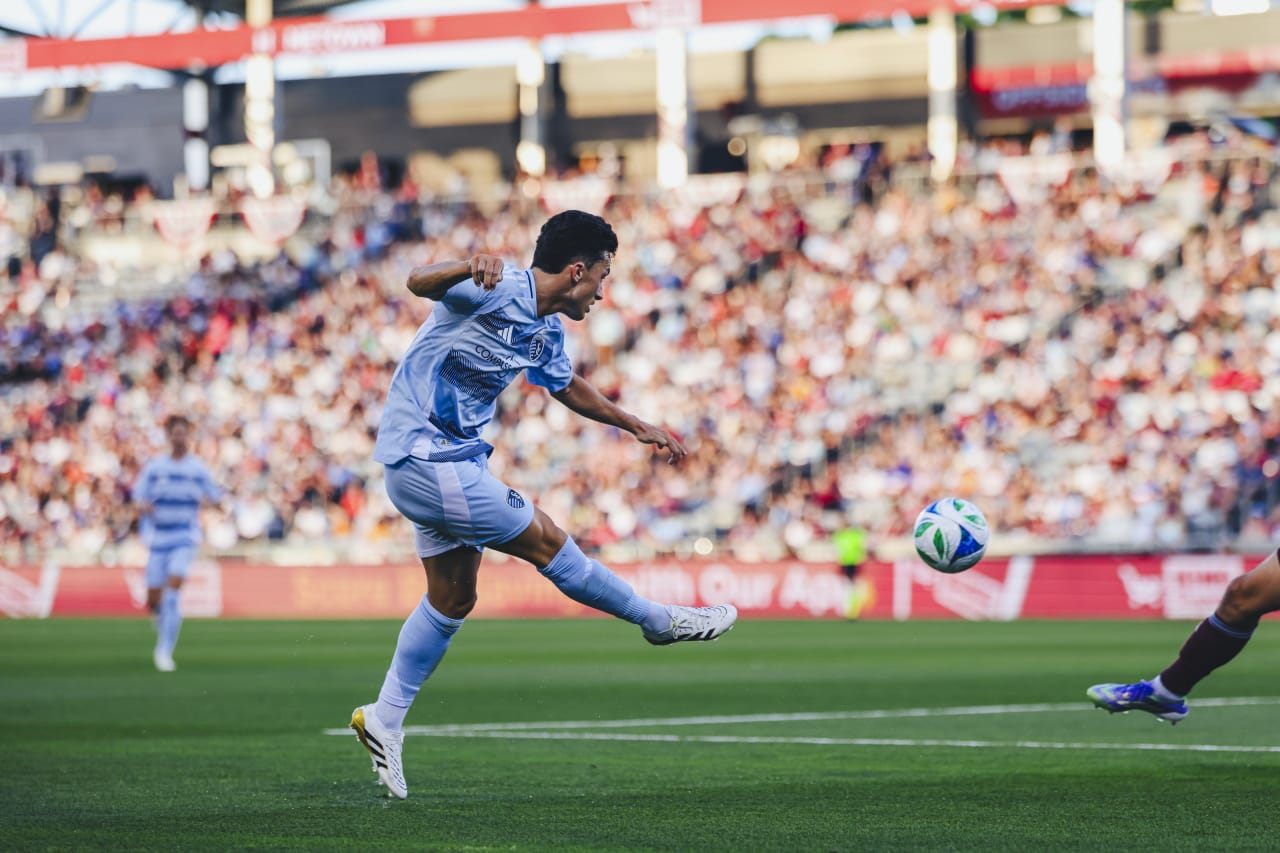 Sporting KC midfielder Manu Garcia crosses the ball