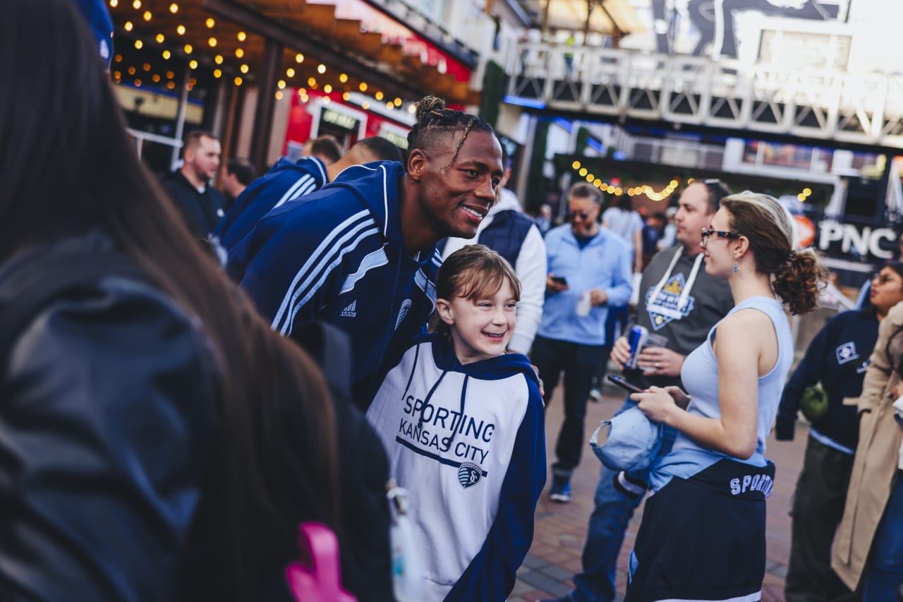 Sporting KC defender Dany Rosero poses for a photo with a young supporter
