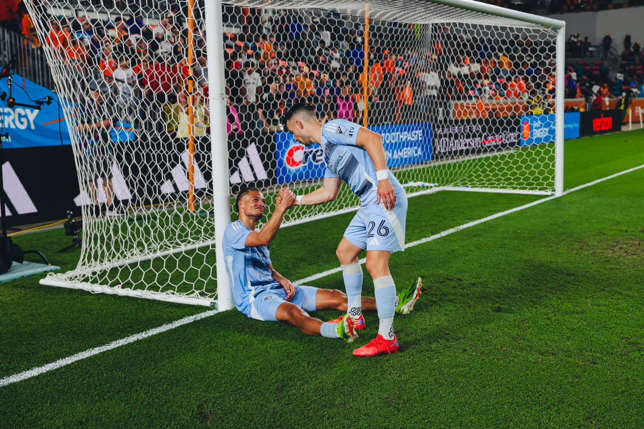 Sporting KC forward Erik Thommy celebrates with midfielder Zorhan Bassong after winning against Houston over the weekend