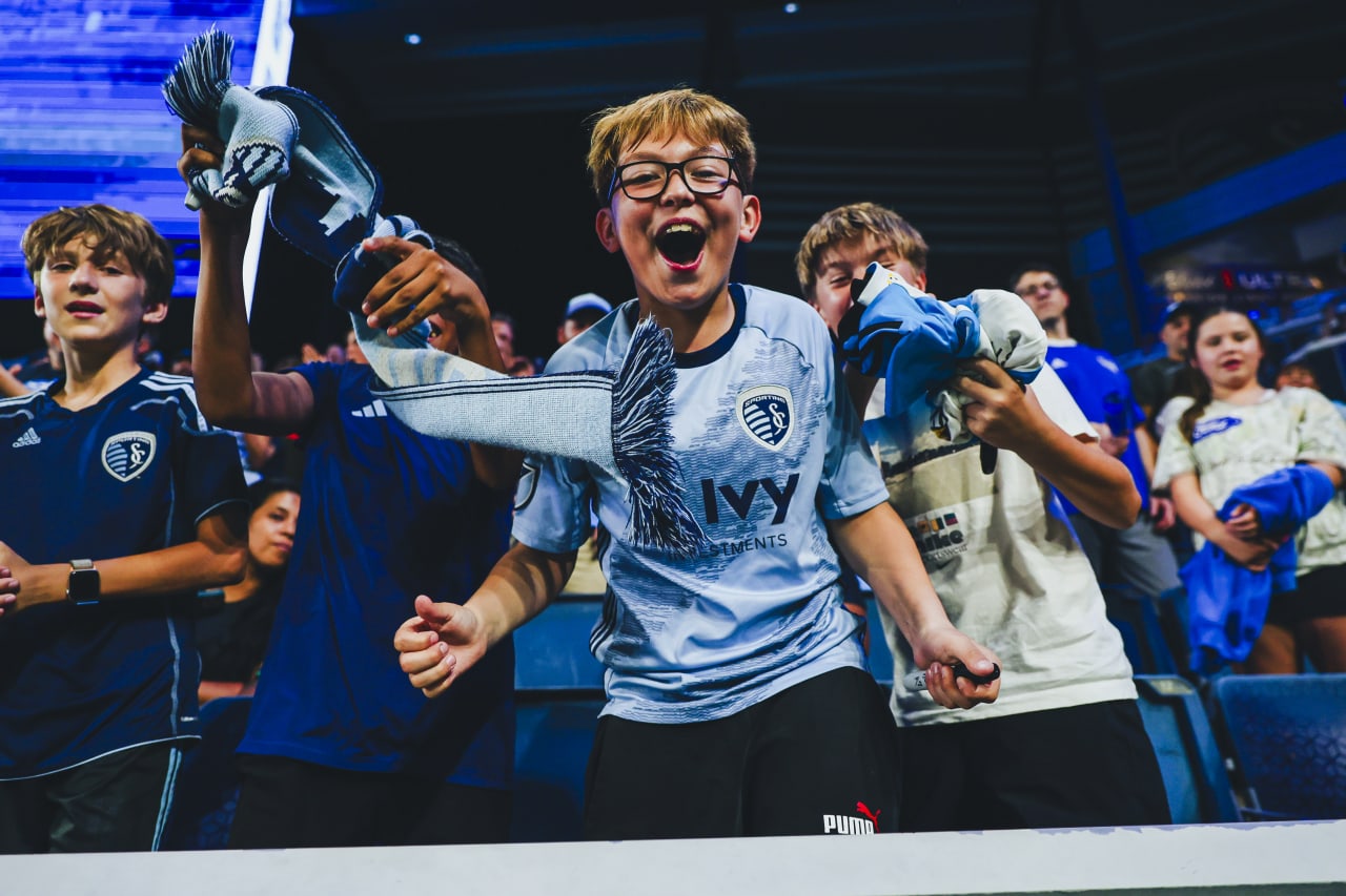 A young Sporting KC fan celebrates after Sporting KC takes the lead against Colorado.