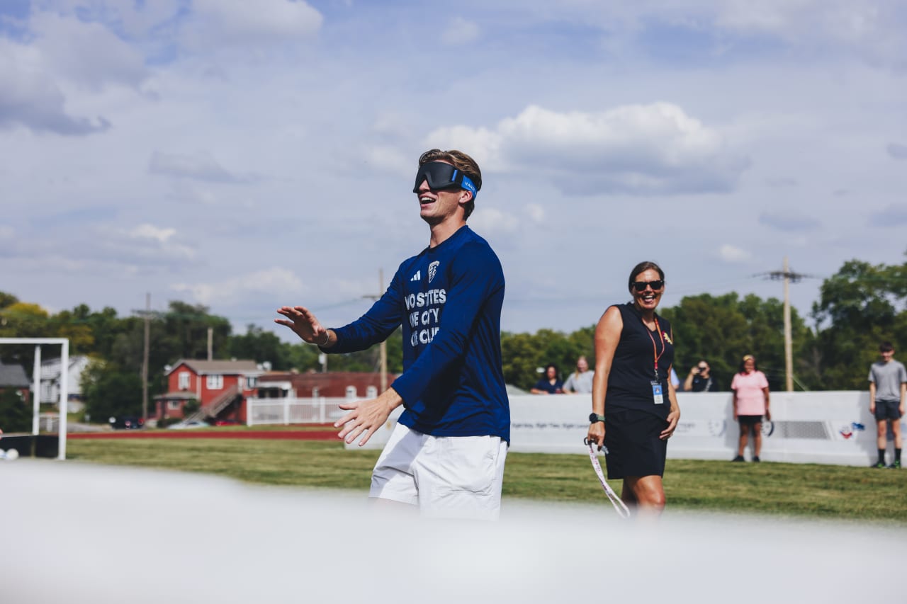 Sporting KC midfielder Jacob Bartlett finds his way while wearing a blindfold.