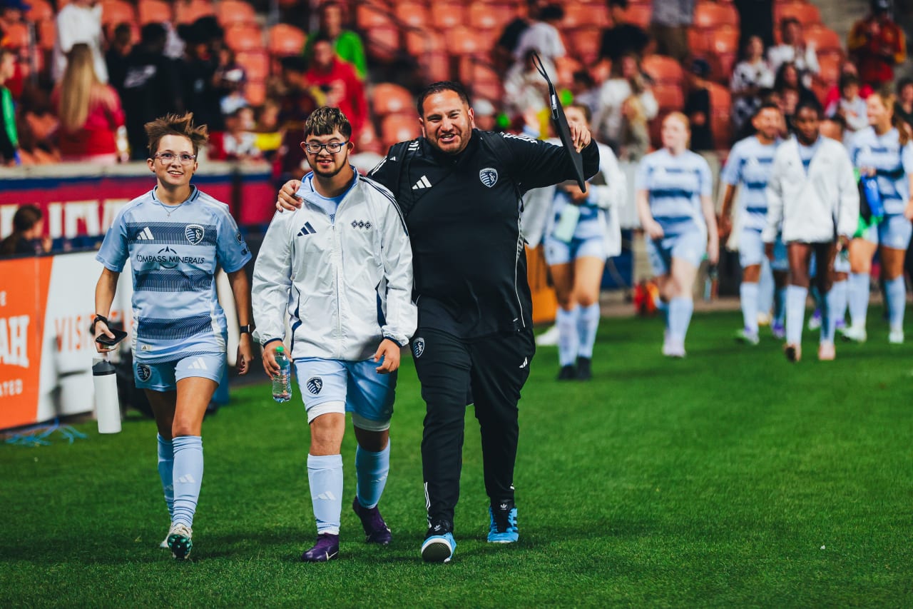 Kaylee Baggerly and Diego Saenz-Quintana  smile with their coach after the game vs RSL Unified. Photo by RSL