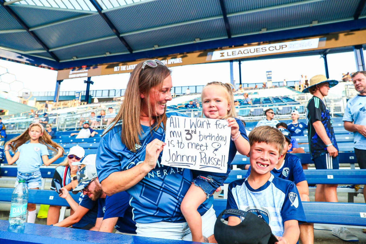A three year old fan waits for Johnny Russell to arrive at Children's Mercy Park.