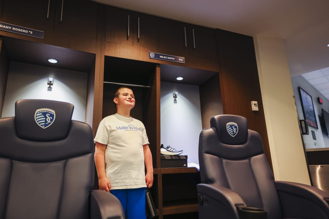 Miles smiles in front of his locker in the SKC locker room.