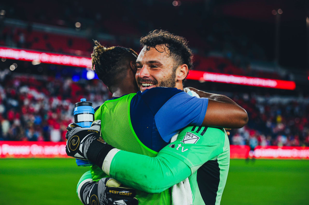 Sporting KC goalkeeper John Pulskamp hugs defender Dany Rosero after the draw with St. Louis