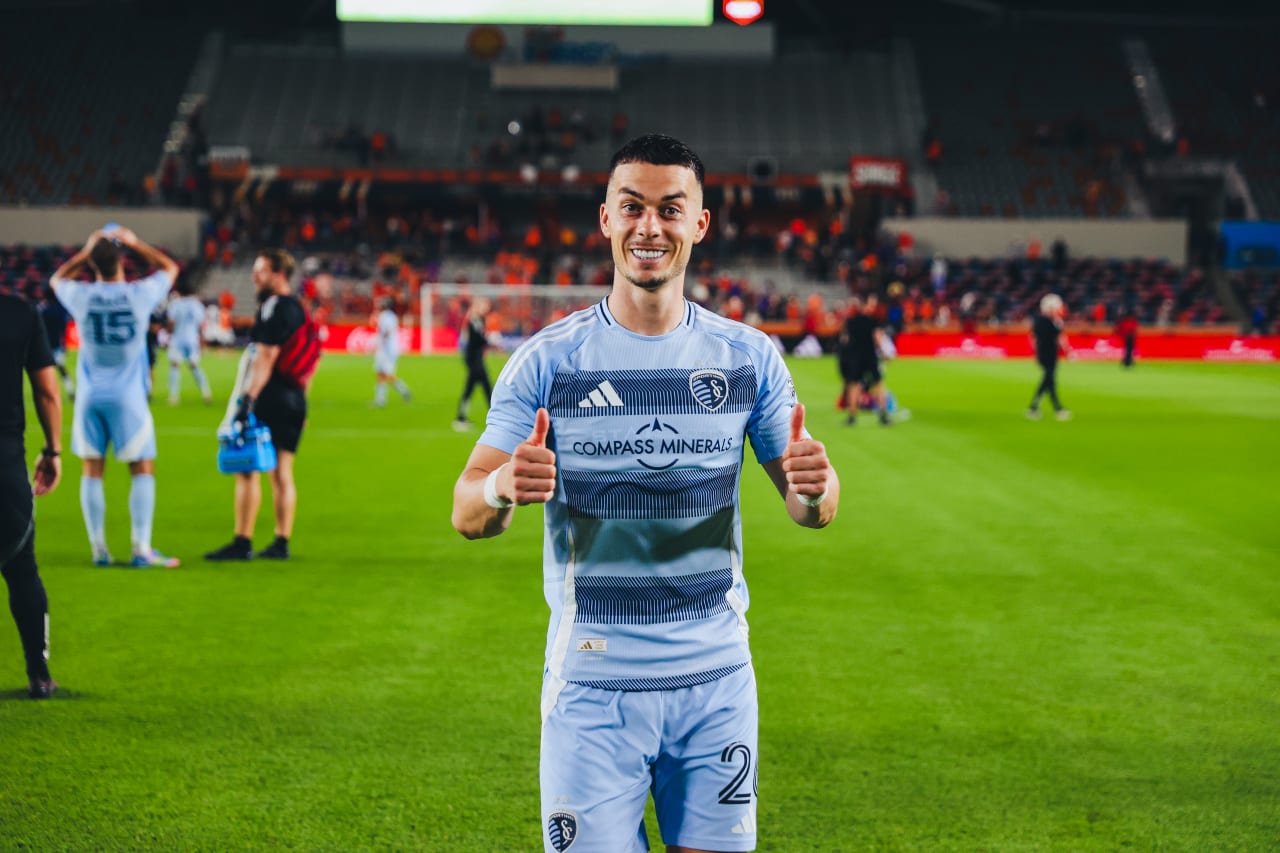 Sporting KC forward Erik Thommy gives a double thumbs up to the camera after defeating Houston 3-1