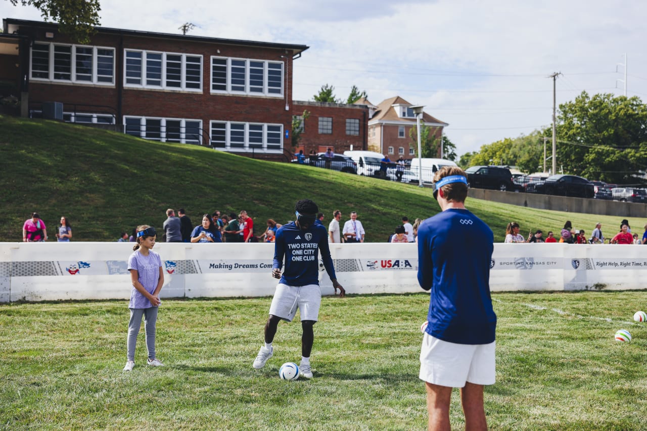 Sporting KC players Stephen Afrifa and Jacob Bartlett attempt to pass while blindfolded.
