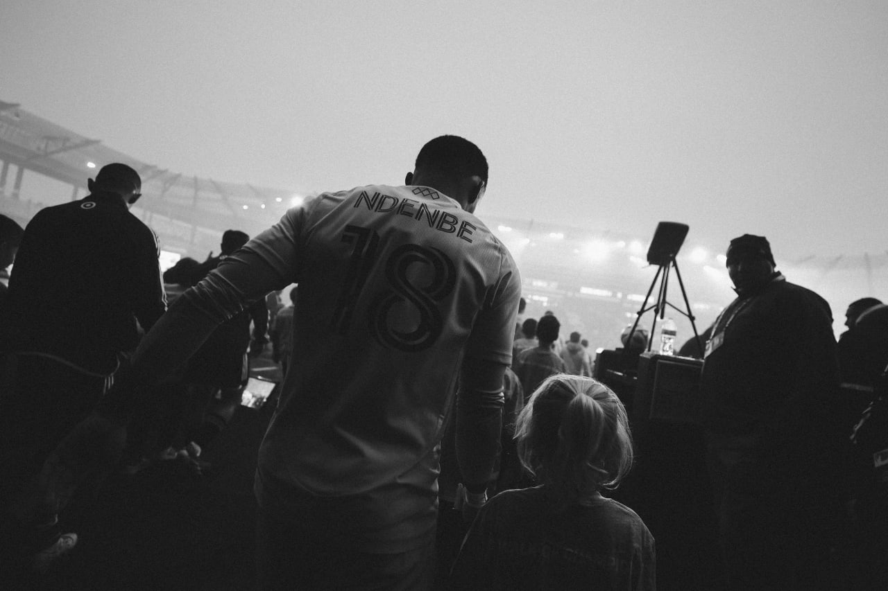 Sporting KC defender Logan Ndenbe walks onto the field in preparation for the game.