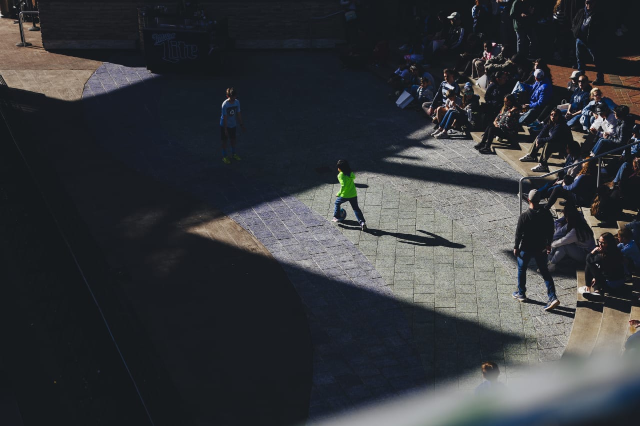 A couple of young kids play soccer at KC Live before the 2025 Block Party