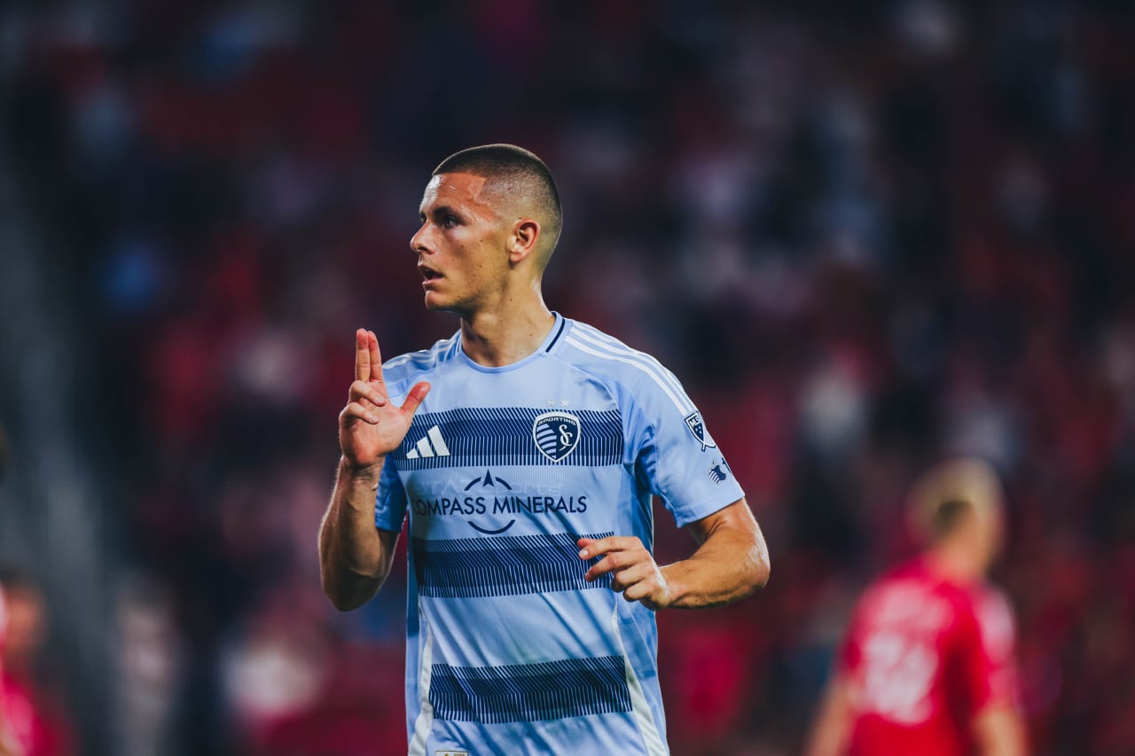 Sporting KC forward Dejan Joveljic does his signature gun celebration after leveling the game at Energizer Park