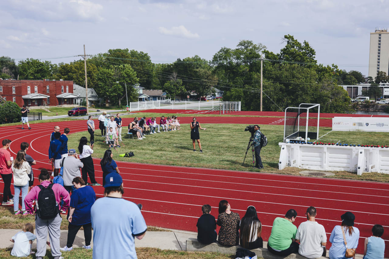 The crowd listens as the instructor announces the rules of blind soccer.