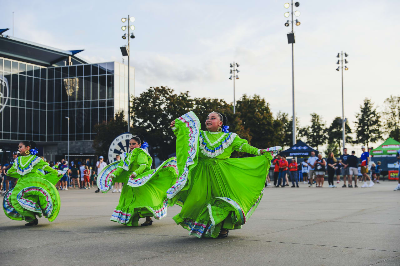 The Guadalupe Center's Aztec Folklórico Dance Team performs on the Mazuma Plaza before the game vs VAN.