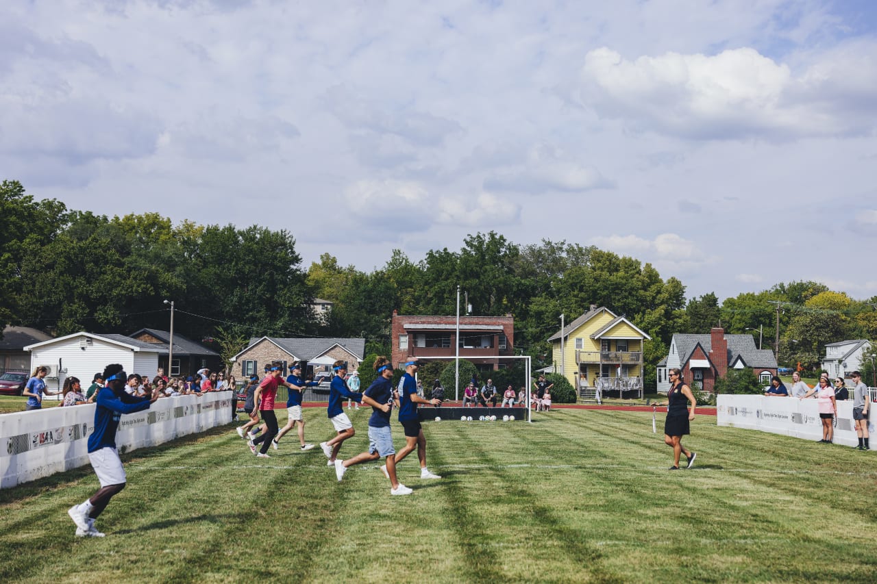 Sporting KC players and associates practice running while blindfolded.