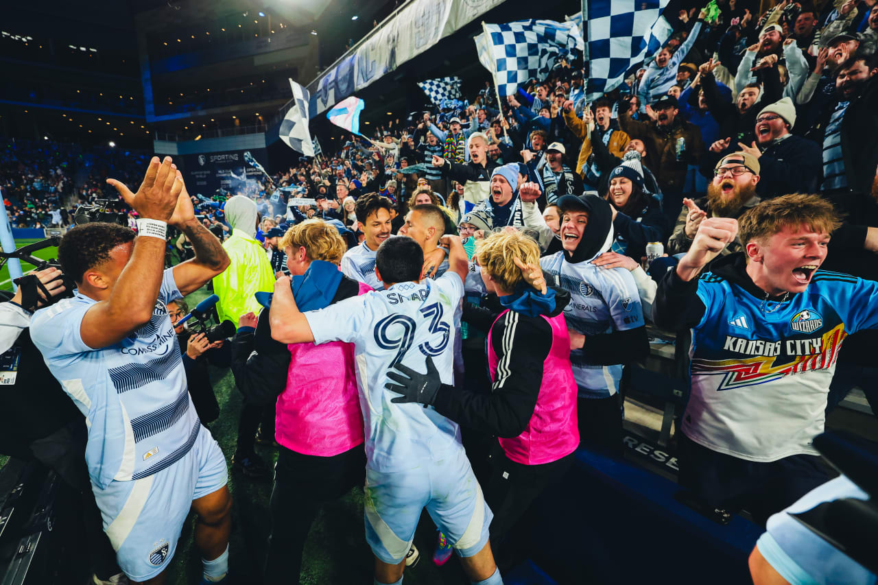 Sporting KC players celebrate with their supporters after the first goal scored vs St. Louis.