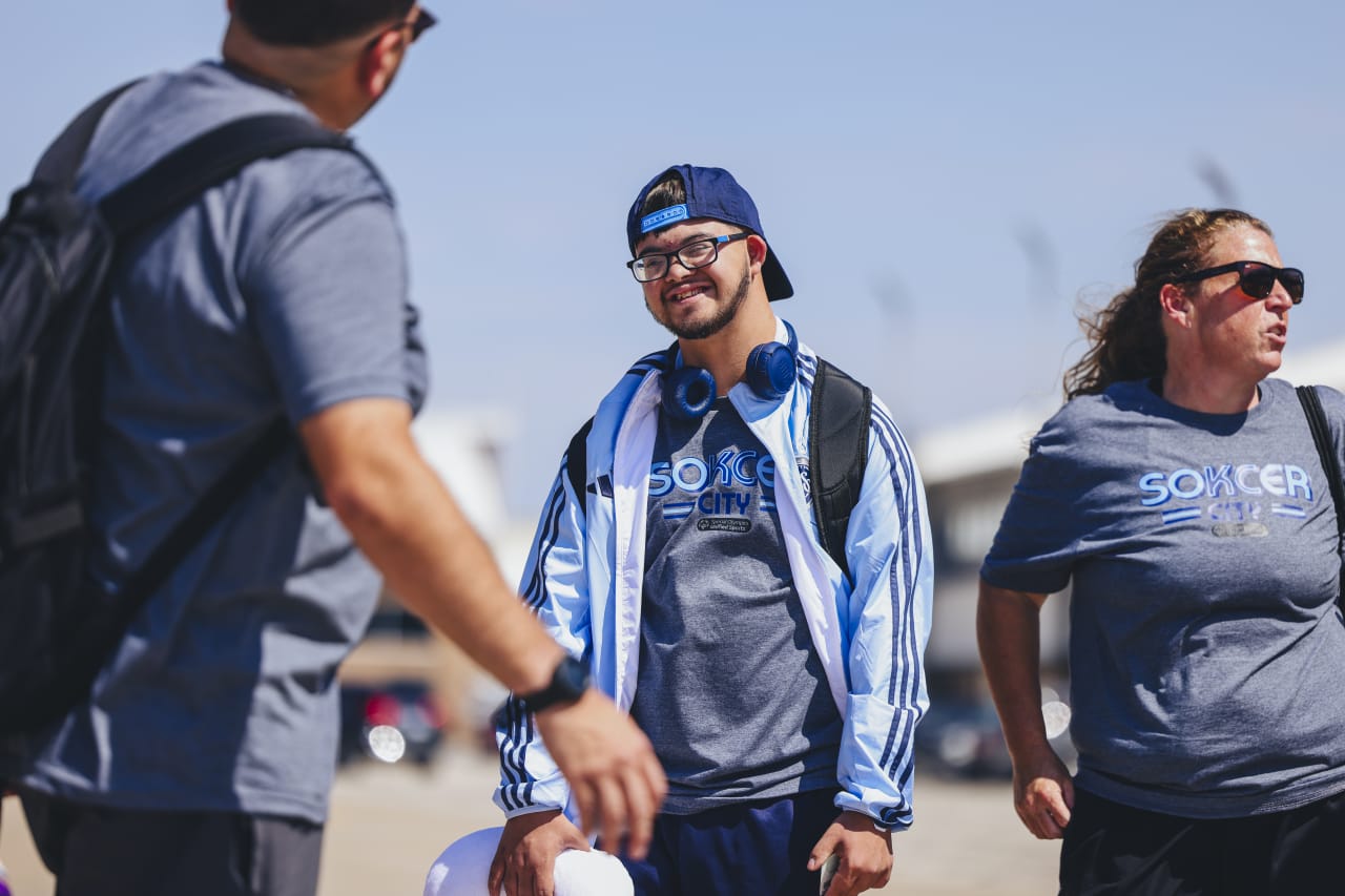 Diego Saenz-Quintana smiles while waiting to board the SKC charter flight.