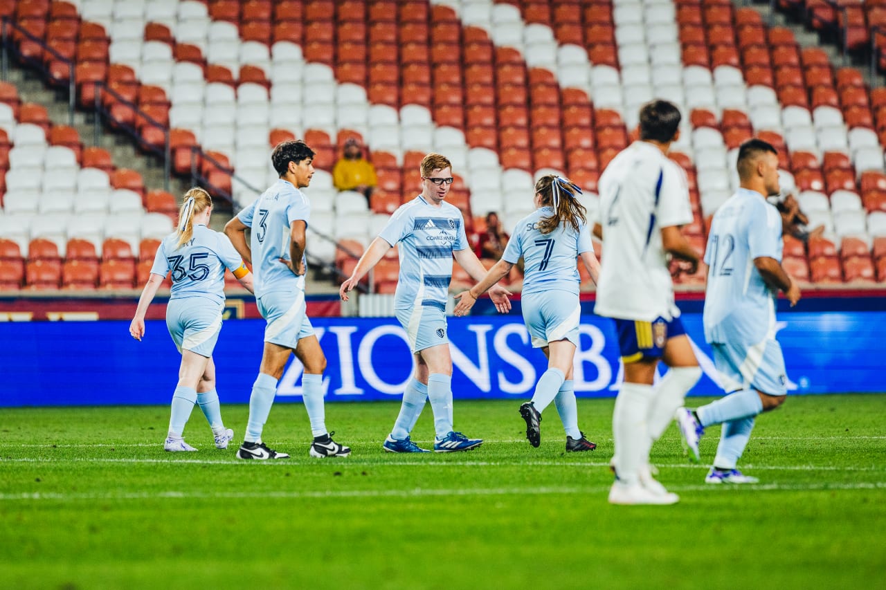 Martin Guerra high fives teammates after scoring a goal during the Unified game in Salt Lake. Photo by RSL