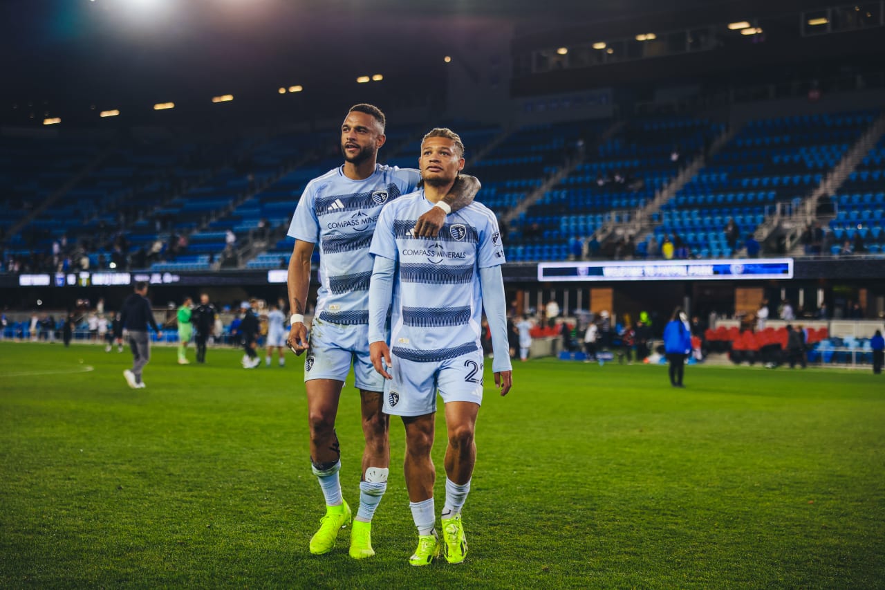 Sporting KC players Khiry Shelton and Zorhan Bassong walk to thank fans after the game in San Jose