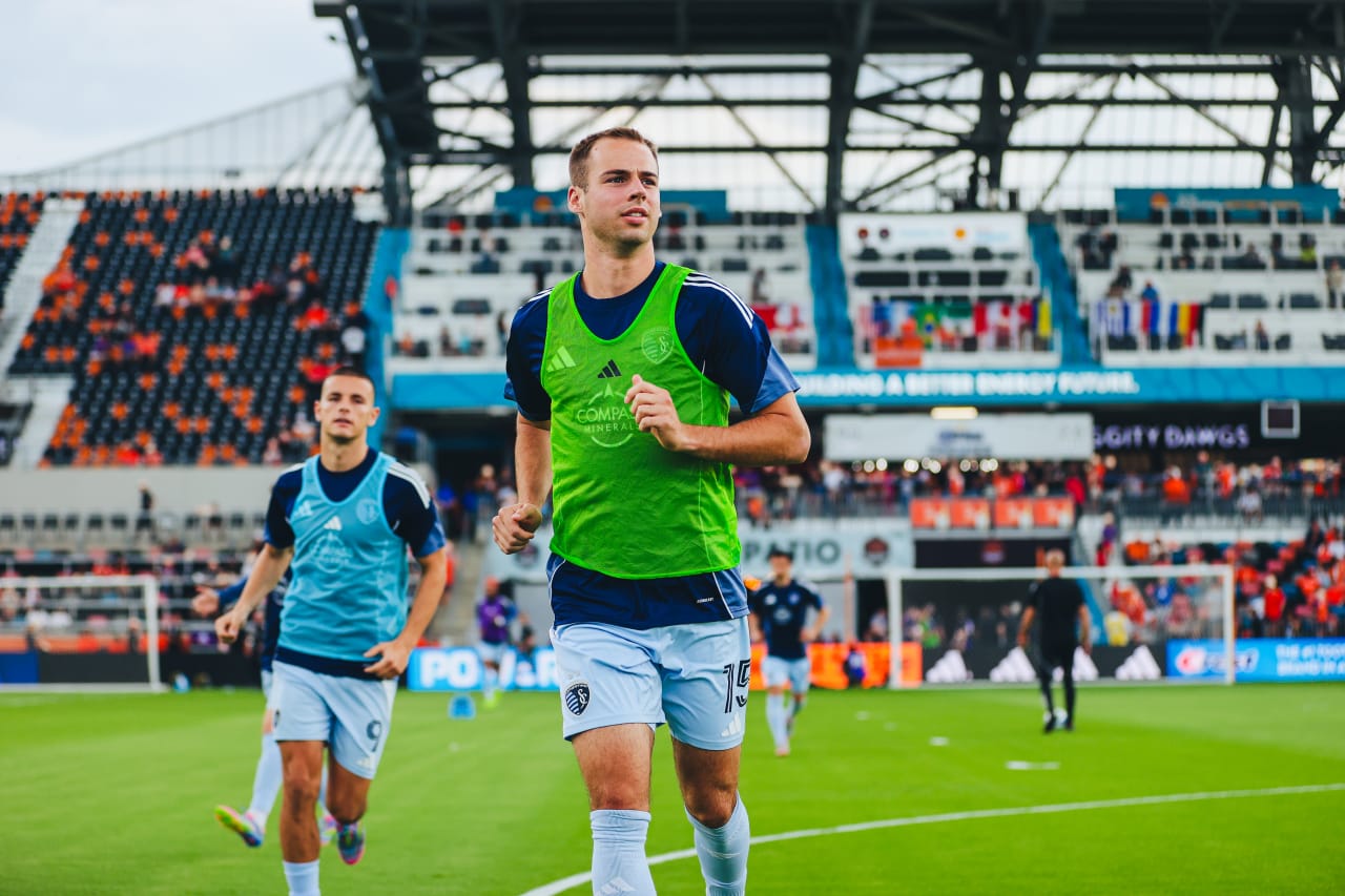 Sporting KC defender Jansen Miller warms up before playing Houston