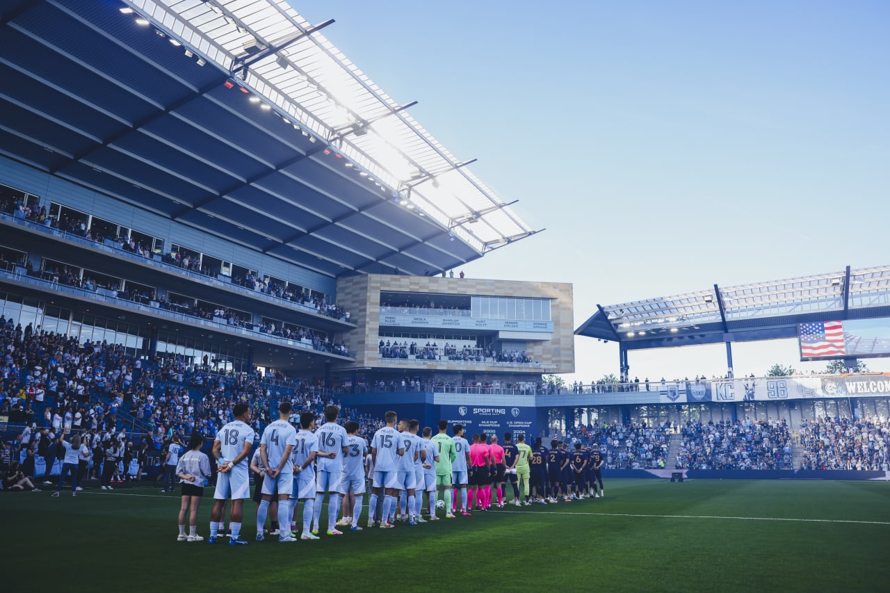 Both teams stand for the National Anthem before the game on May 4th.