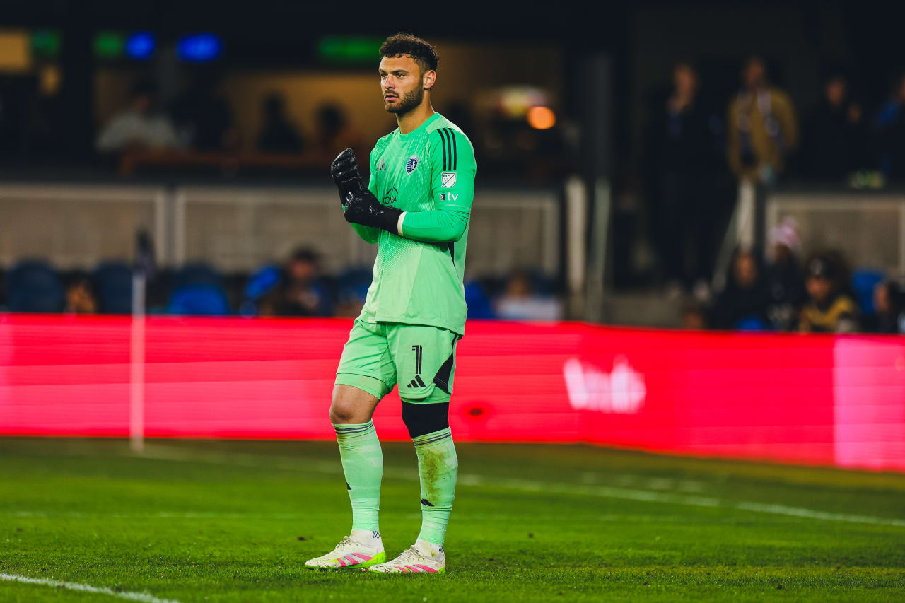 Sporting KC goalkeeper John Pulskamp adjusts his gloves during the game vs San Jose