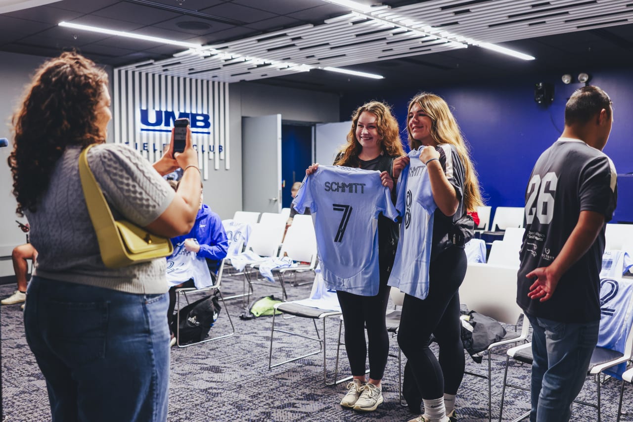 Unified players Hallie Schmitt and Helen Schmitt pose with their jerseys