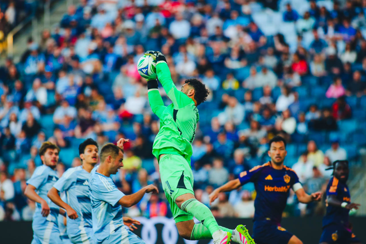Sporting KC goalkeeper John Pulskamp saves a shot.