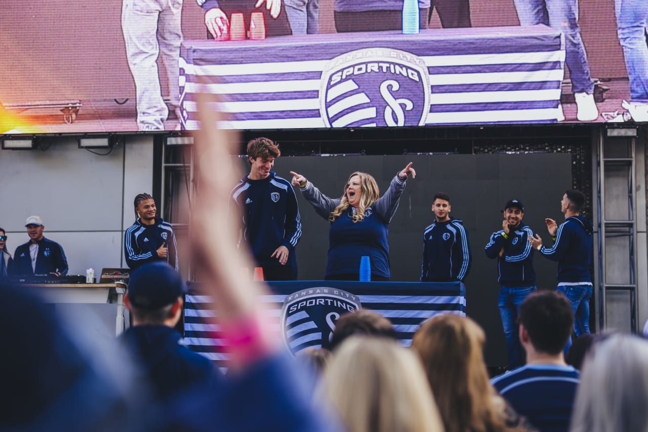 A minute-to-win-it contestant celebrates victory against her opponent, Sporting KC midfielderJacob Bartlett