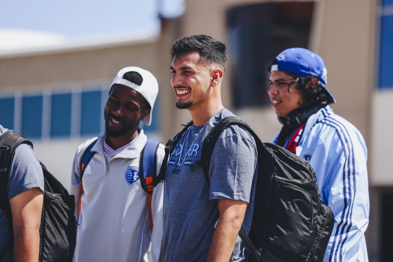 German Castillo laughs as he walks to board the SKC charter flight.