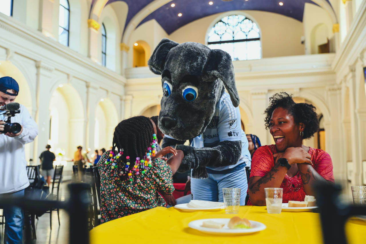 Sporting KC Mascot Blue, meets students during the Backpack Drive delivery on