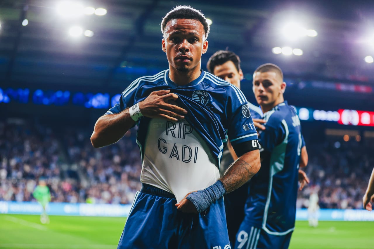 Sporting KC defender Logan Ndenbe shows his undershirt after a goal that says "RIP GADI"