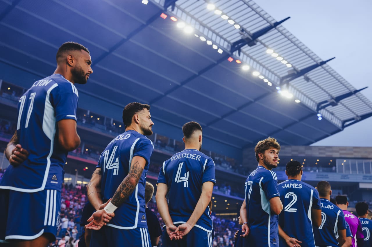 Sporting KC midfielder Jake Davis looks back during the national anthem before the game.