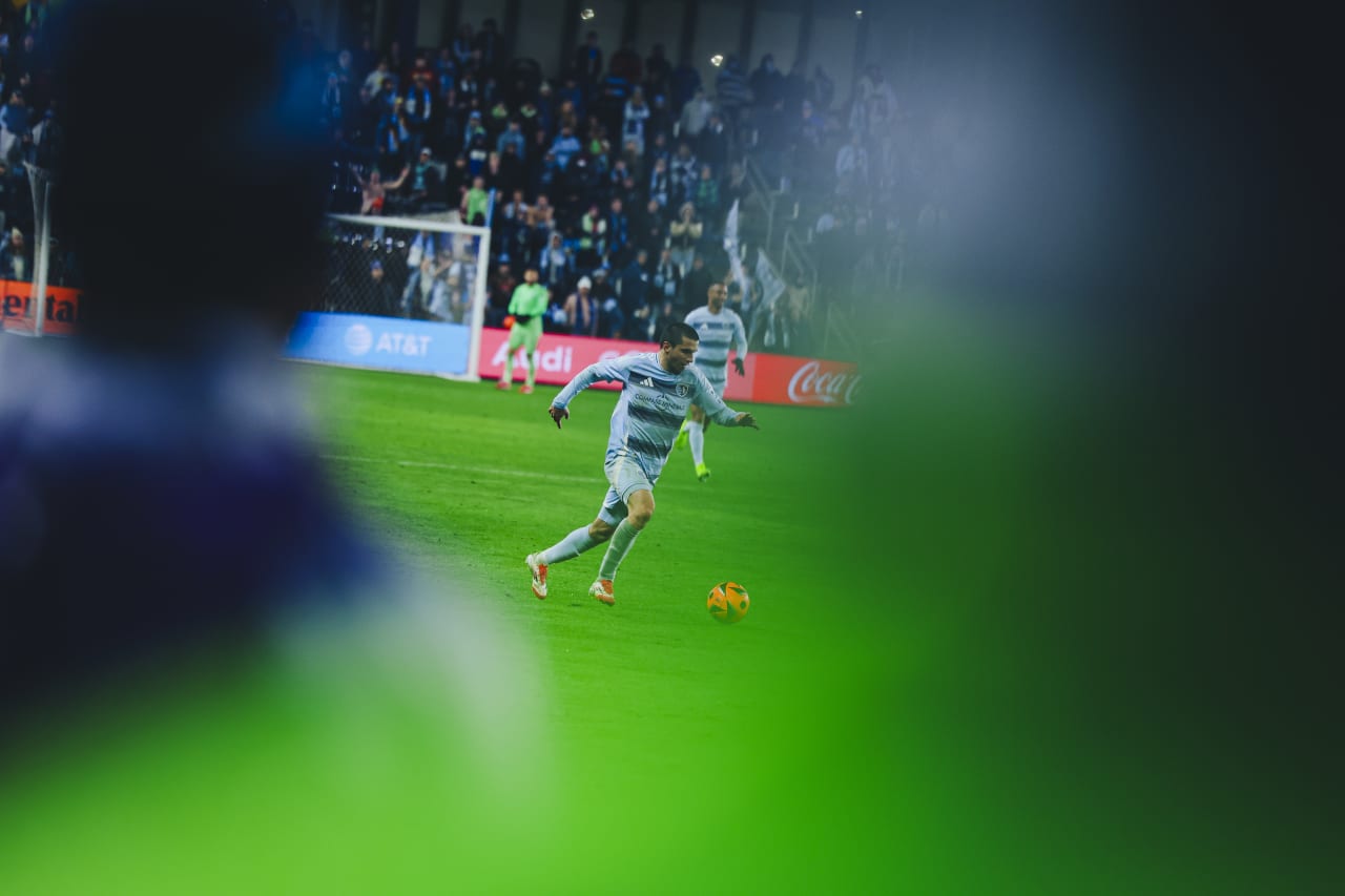 Sporting KC winger Shapi Suleymanov dribbles the ball down the line.