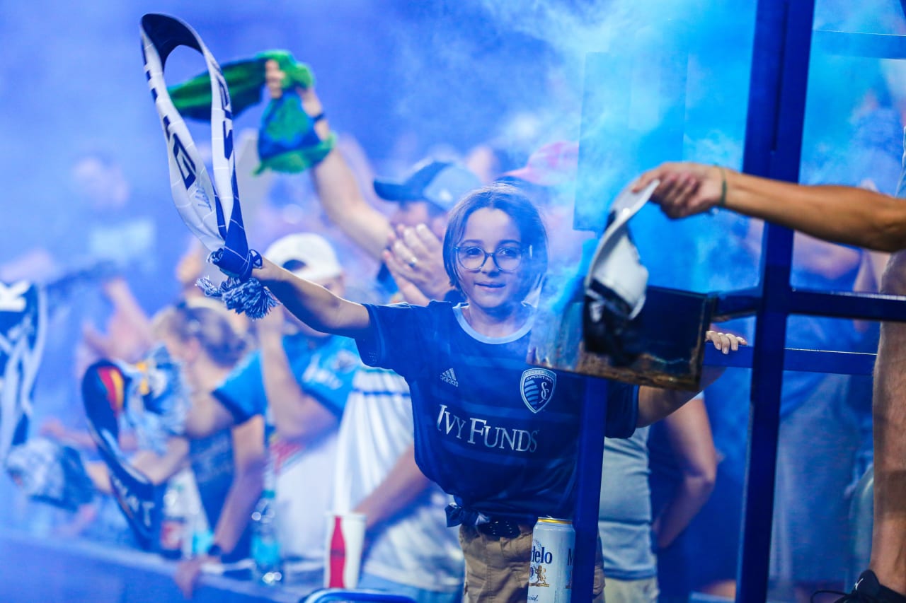Waving their scarf in the air, a young fan celebrates a win over Chicago Fire on Jul 28.