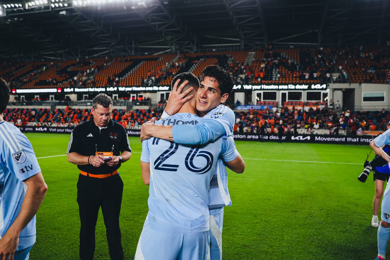 Sporting KC forwards Santiago Munoz and Erik Thommy hug each other after beating Houston
