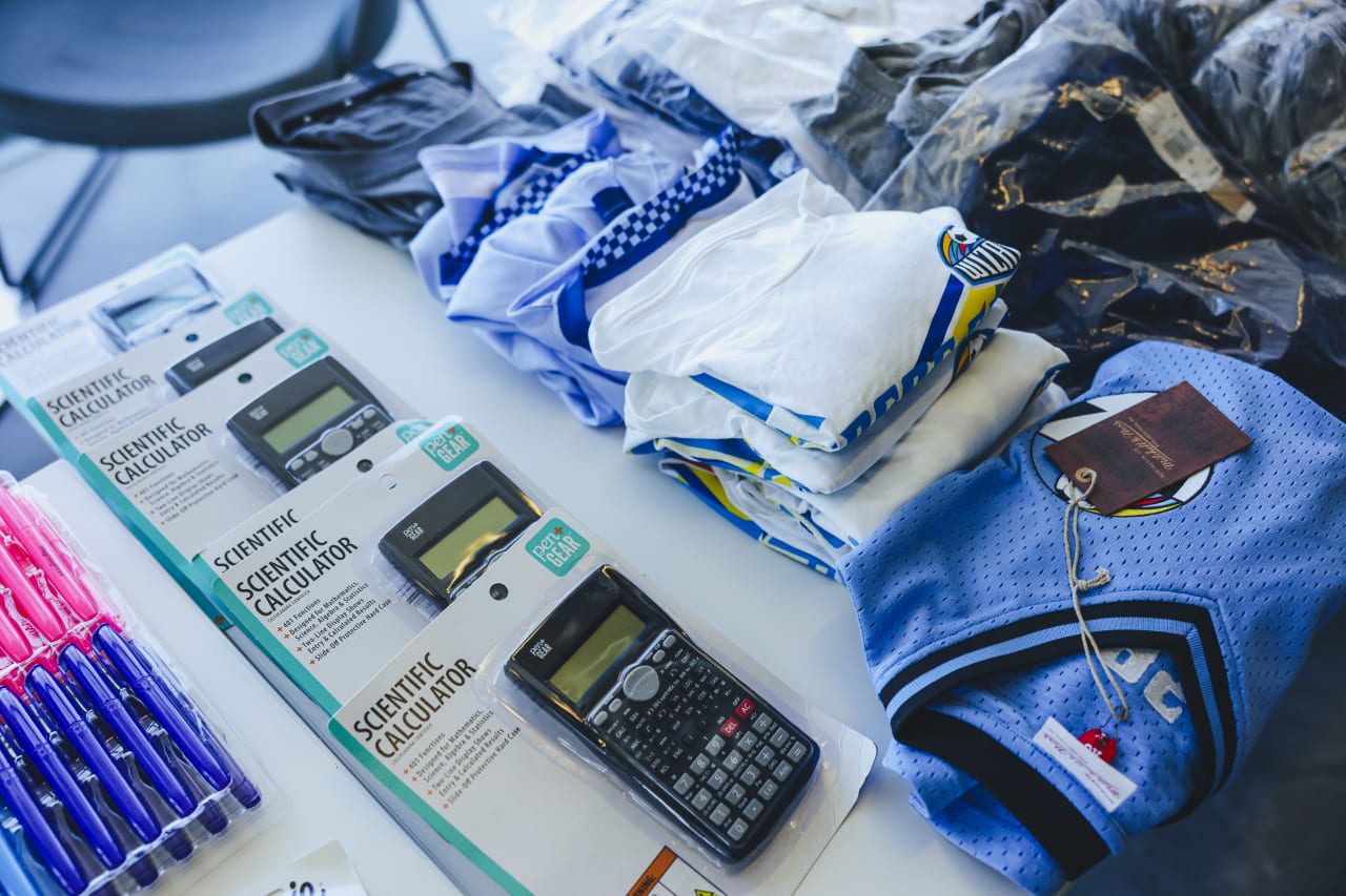 Sporting swag donated by SportingStyle, water bottles, and heartfelt handwritten letters of encouragement for each student.