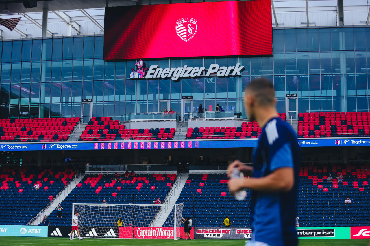 Sporting KC forward Dejan Joveljic looks at the Energizer Park sign after arriving for the game