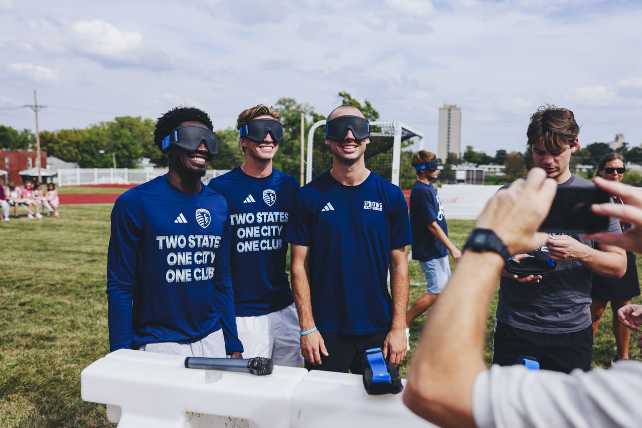 Sporting KC players Stephen Afrifa, Jacob Bartlett, and Jansen Miller pose with their blind soccer blindfolds.