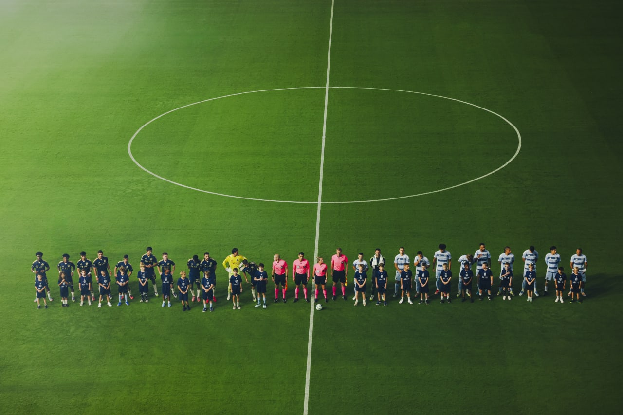 Sporting KC and Vancouver line up for the National Anthem before the game.