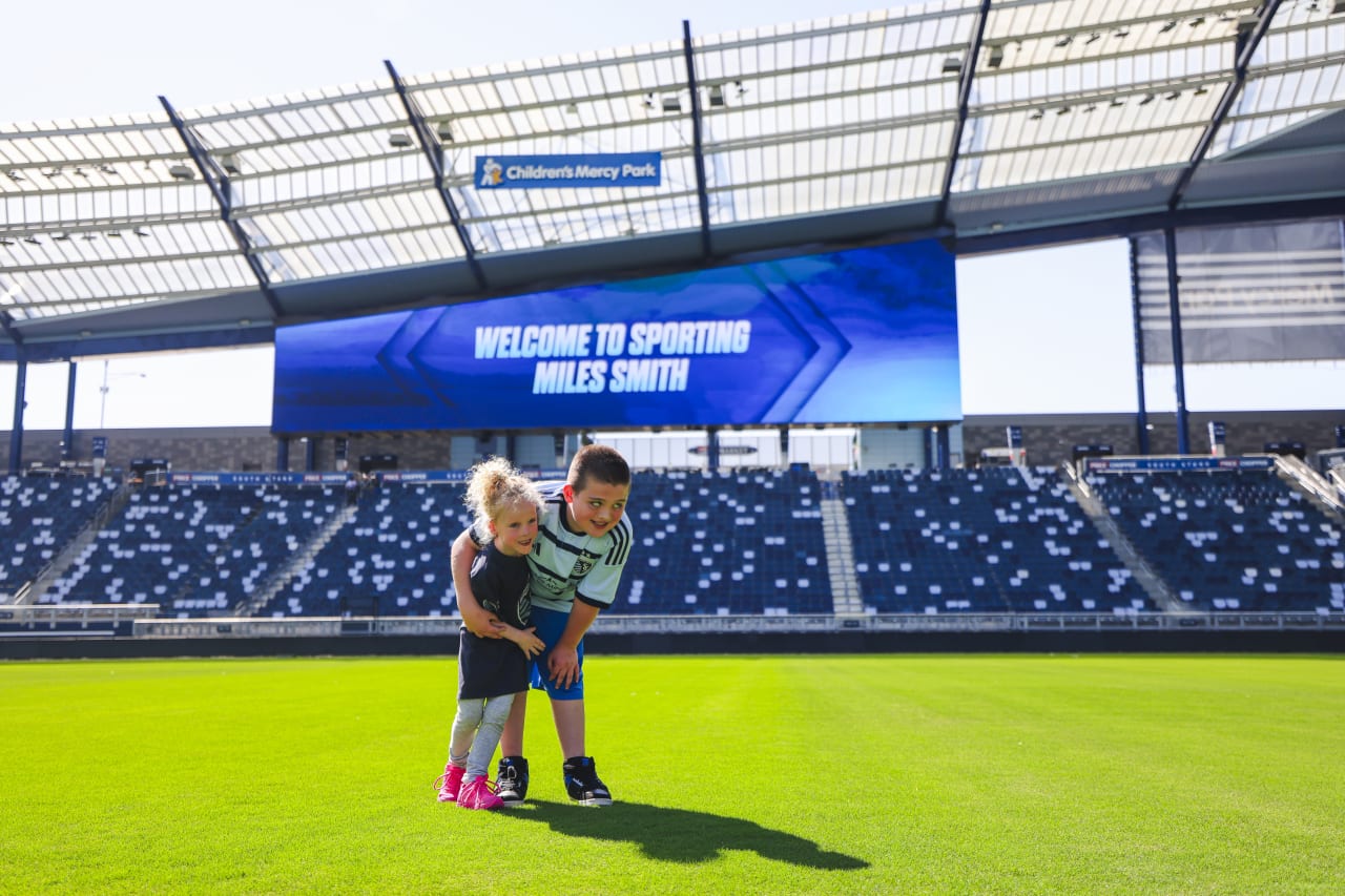 Miles and his sister Penelope take a picture at Children's Mercy Park.