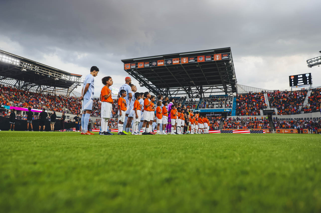 Sporting KC lines up for the national anthem before playing Houston