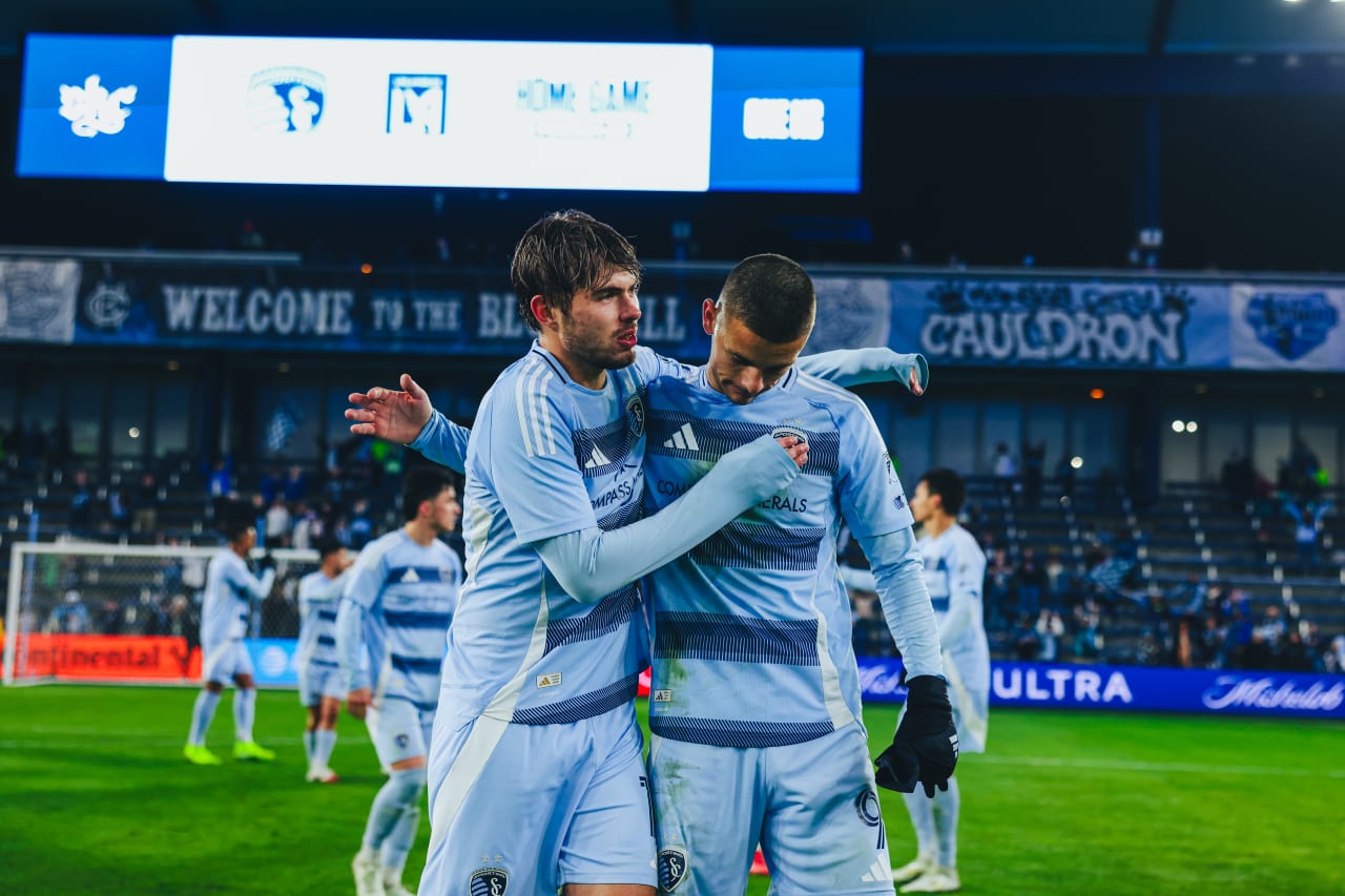 Sporting KC player Davis hugs Dejan Joveljic post game.