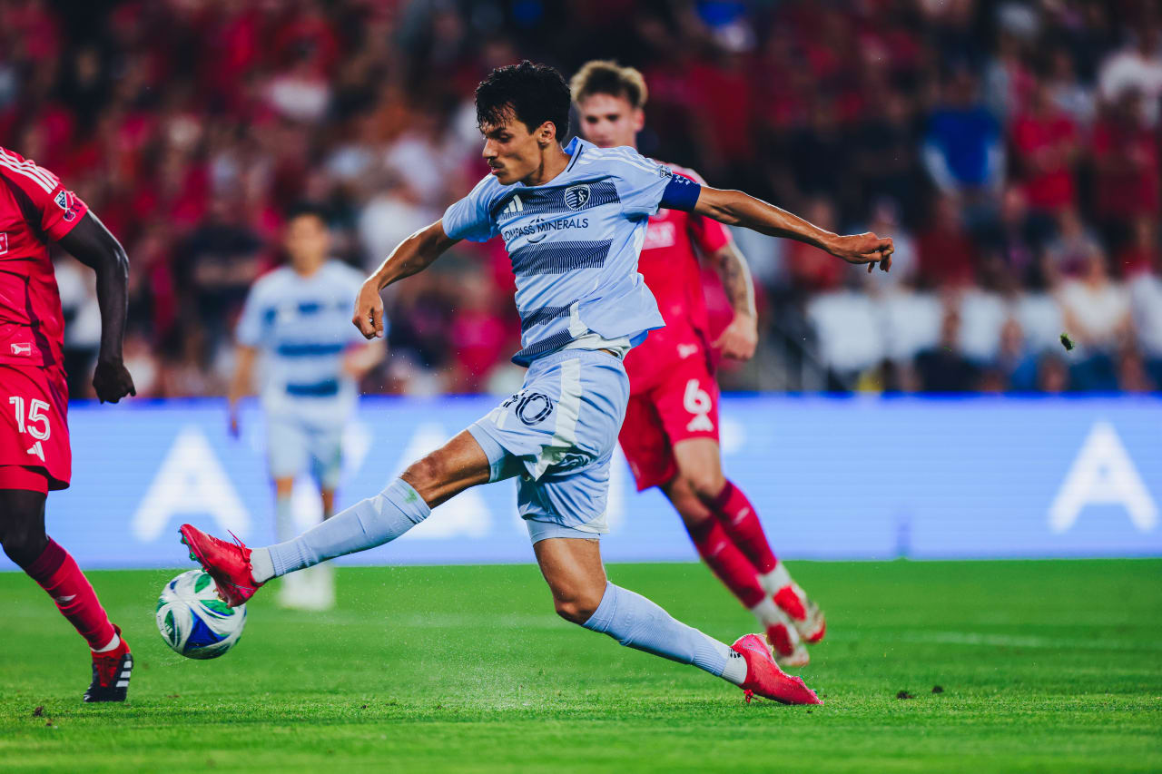 Sporting KC forward Daniel Salloi shoots the ball