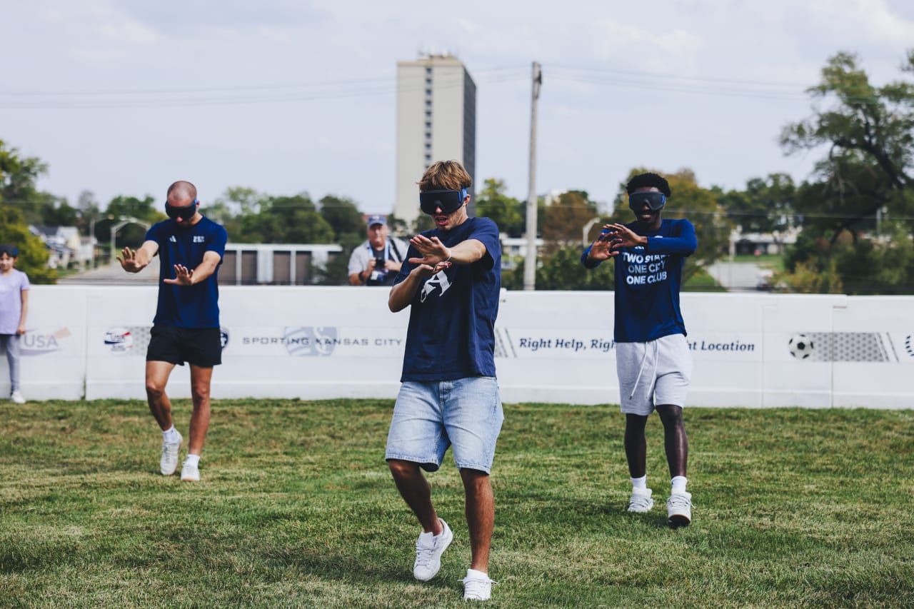 Sporting KC midfielder Jake Davis practices walking with a blind soccer blindfold.